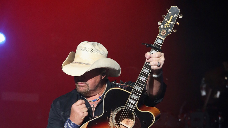 Toby Keith playing the guitar