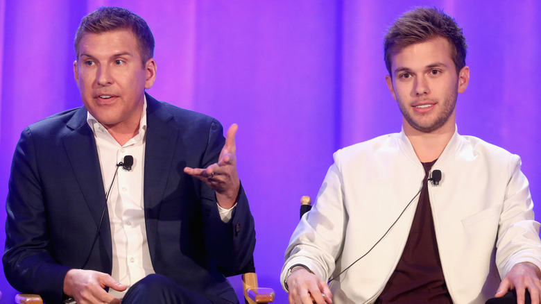 Todd Chrisley And Chase Chrisley talking on stage