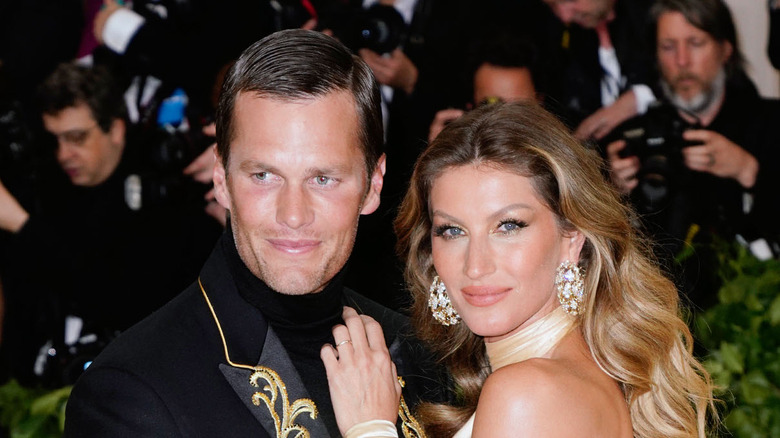 Tom Brady and Gisele Bündchen attending an event