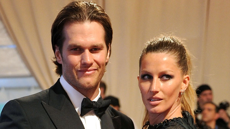 Tom Brady and Gisele Bündchen attending an event