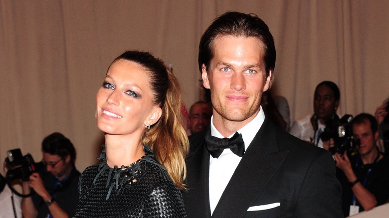 Tom Brady and Gisele Bündchen attending an event