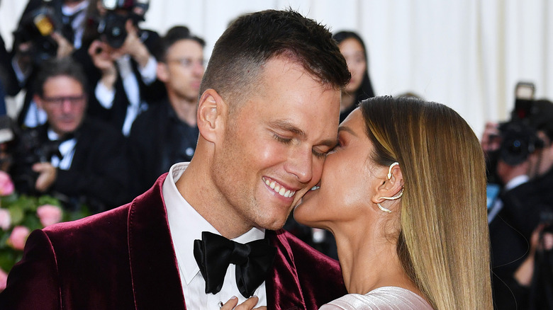 Tom Brady and Gisele Bündchen attending an event