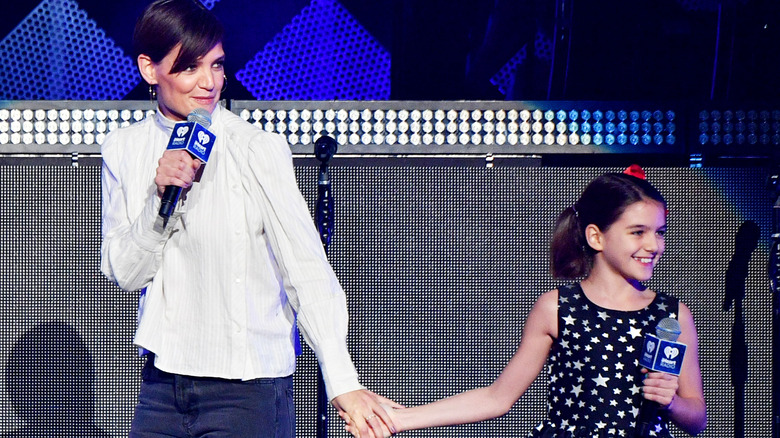 Katies Holmes and Suri on stage