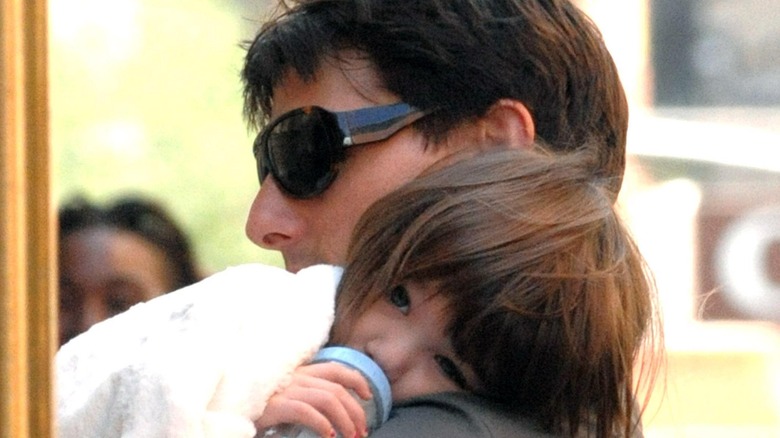 Tom Cruise holding baby Suri