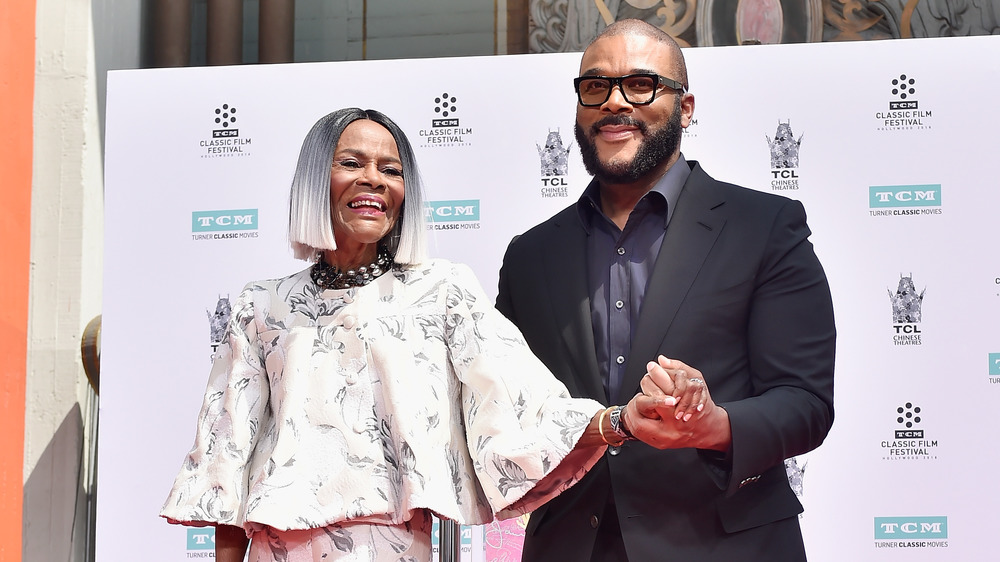 Tyler Perry holding Cicely Tyson