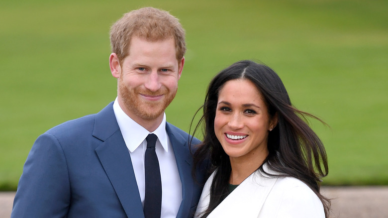 Harry and Meghan smiling 