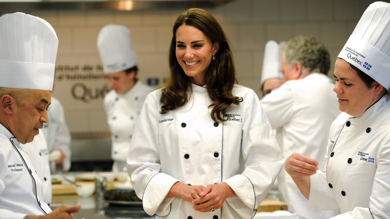 Kate Middleton in a kitchen cooking