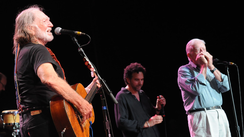 Jimmy Carter on stage with Willie Nelson