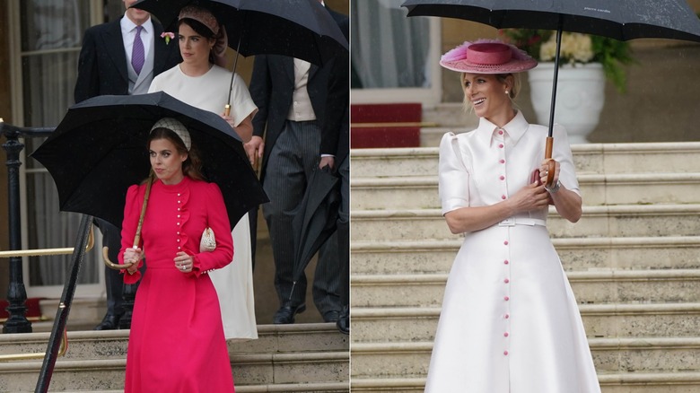 Princess Eugenie and Zara Tindall holding umbrellas