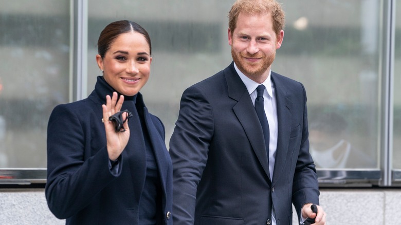 Meghan Markle and Prince Harry greeting fans