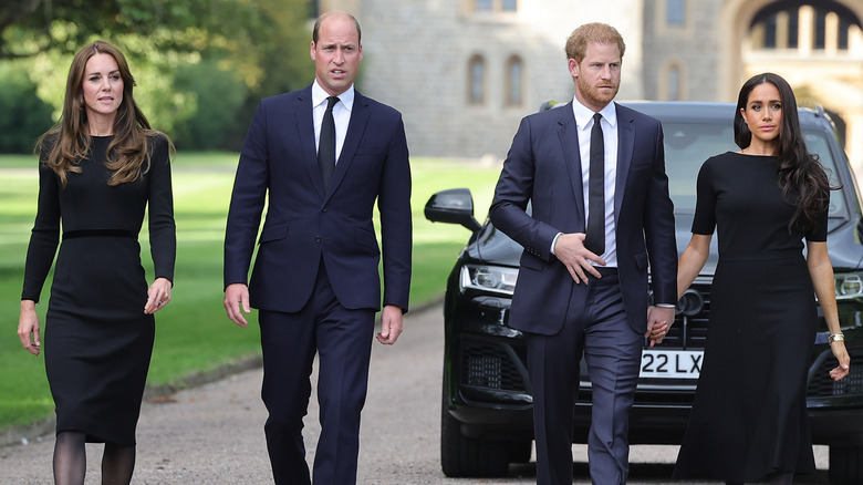 Prince William, Kate Middleton, Prince Harry, and Meghan Markle walking