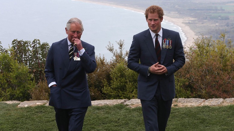 King Charles and Prince Harry walking