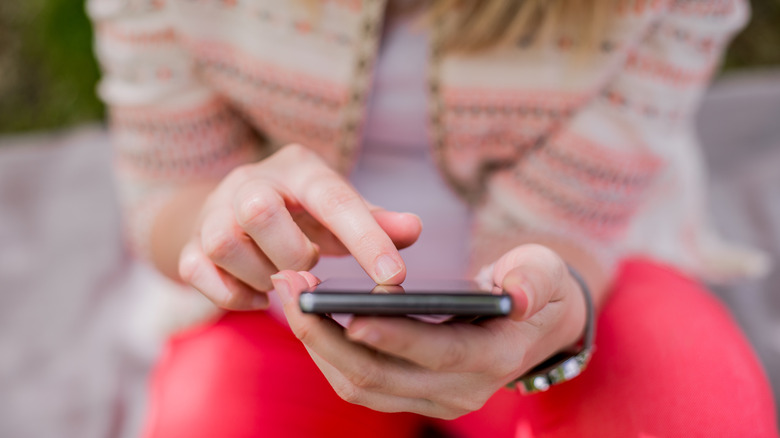 Woman looking at her phone