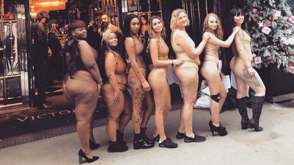 A diverse group of women participating in a protest against Victoria's Secret