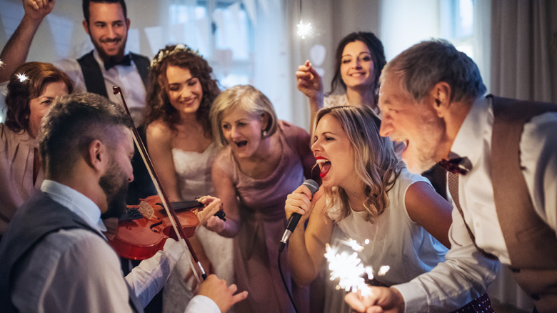 guest singing at wedding reception