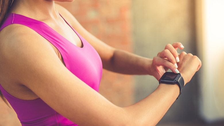 woman training with Fitbit