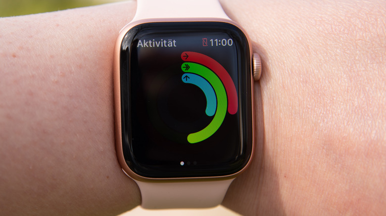 Woman checking Apple Watch for exercise stats