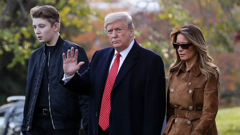 Barron Trump walking with his parents