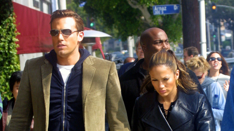 Ben Affleck and Jennifer Lopez hold hands.