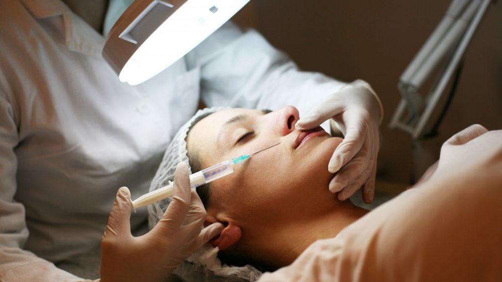 Woman having botox treatment