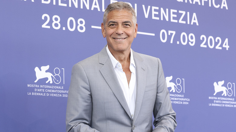 George Clooney smiling while looking into the camera