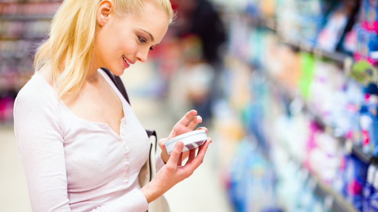 A woman shopping for skincare