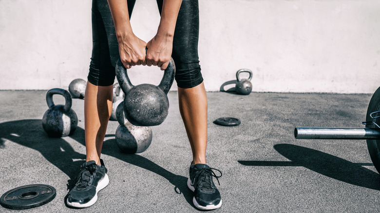 Person holding kettlebell 