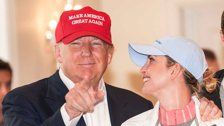 Donald Trump in MAGA hat with Ivanka Looking at her dad