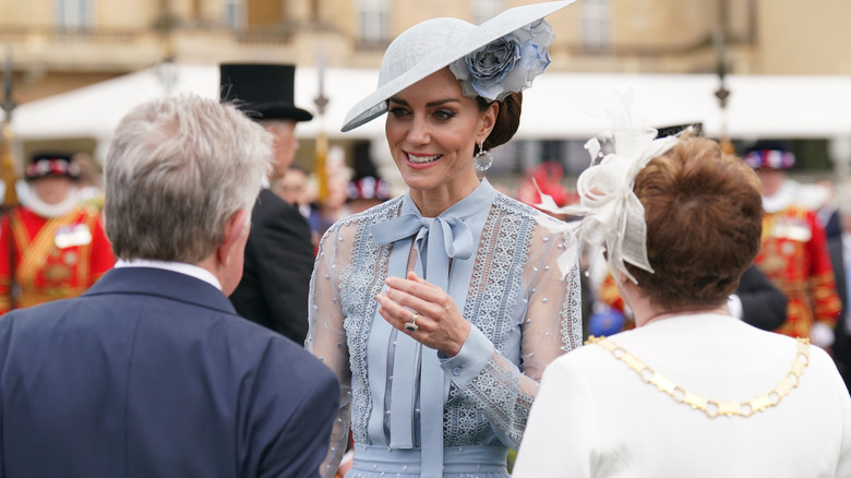 Kate Middleton smiling and talking to fans