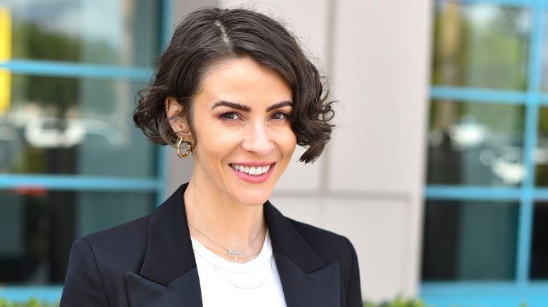 Linsey Godfrey smiles for the camera. 