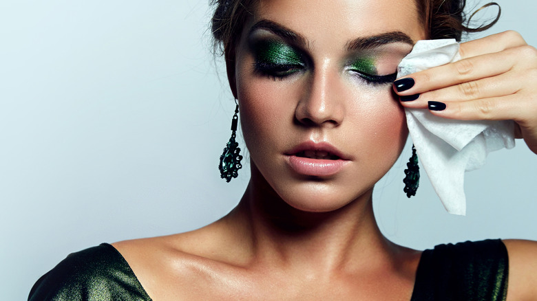 Woman removing her eye makeup