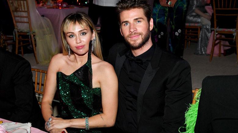 Miley Cyrus Liam Hemsworth posing