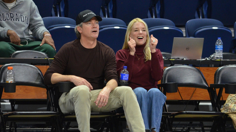 John Wakefield and Pam Bondi watch the game between Charleston Cougars and the North Carolina-Wilmington Seahawks