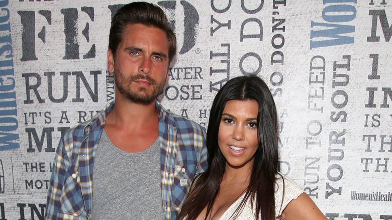 Scott Disick and Kourtney Kardashian at an event. 