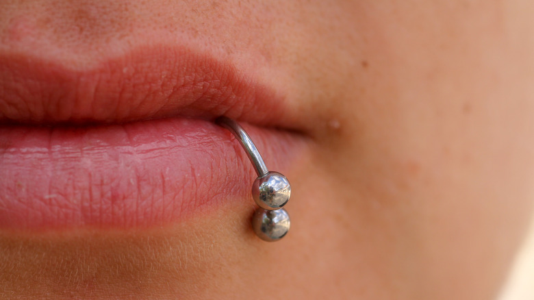 Close up of lip piercing