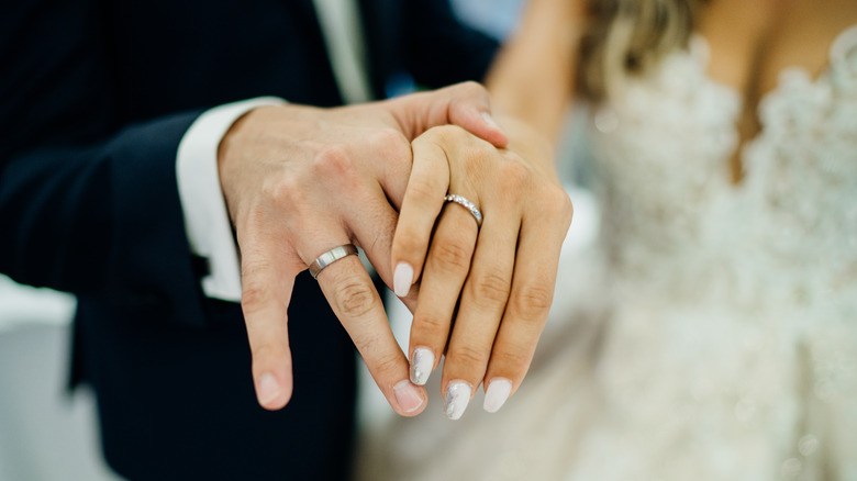 Couple holding hands