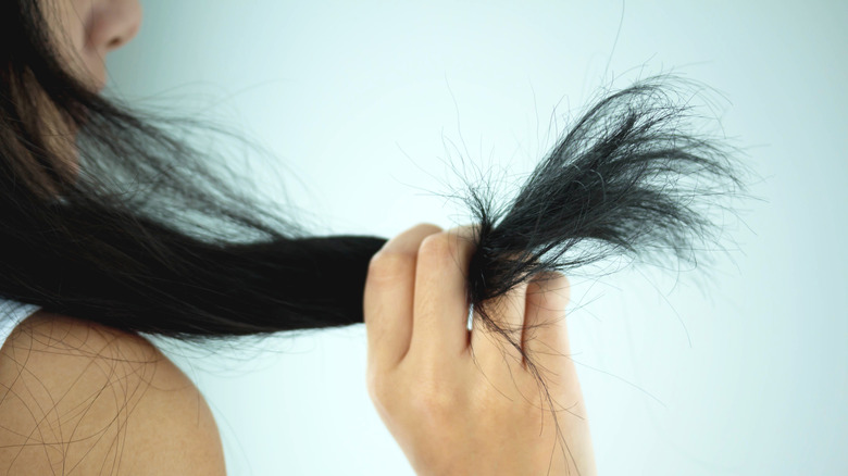 Woman with thick hair strand