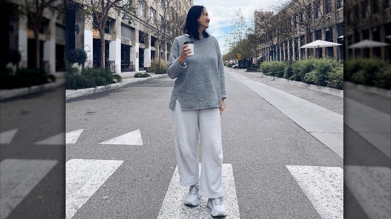 Woman in gray outfit posing