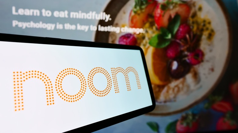 cellphone with noom logo 