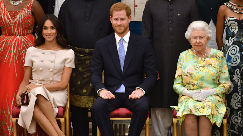 The Queen, Prince Harry and Meghan Markle at a royal event