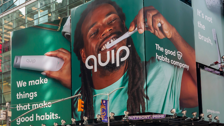 Billlboard Ad of Man Brushing with Quip