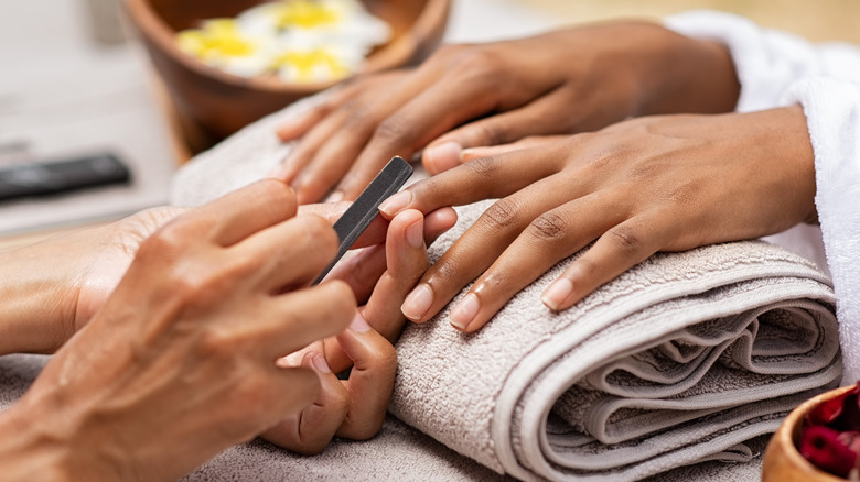 Hands being manicured