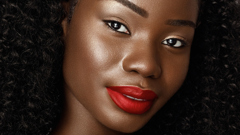 Young Black woman wearing red lipstick