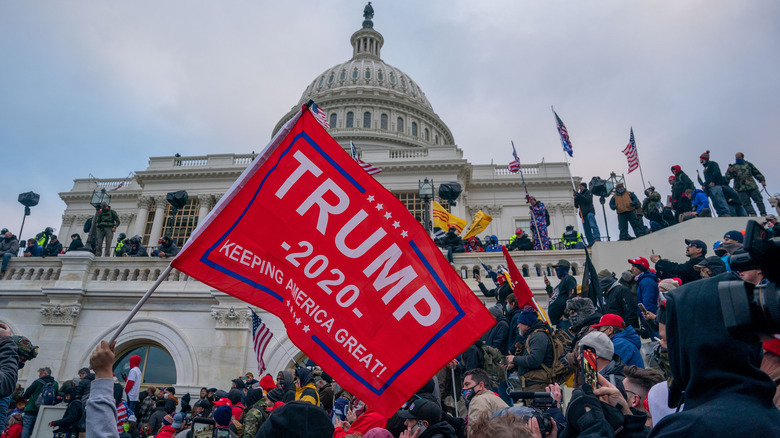 Supporter with red Trump flag