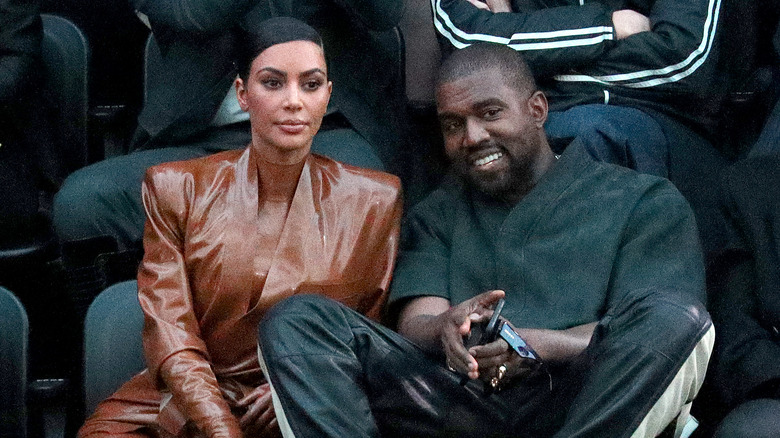 Kim Kardashian and Kanye West at a sports game