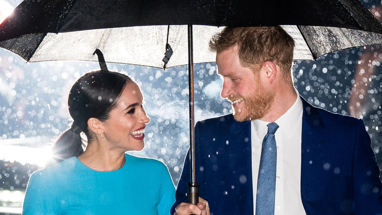 Meghan and Harry look lovingly at each other