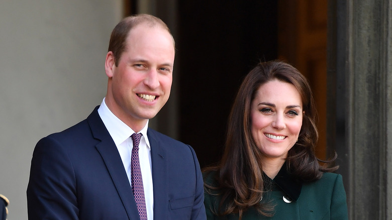 Prince William and Kate Middleton pose for a photo. 