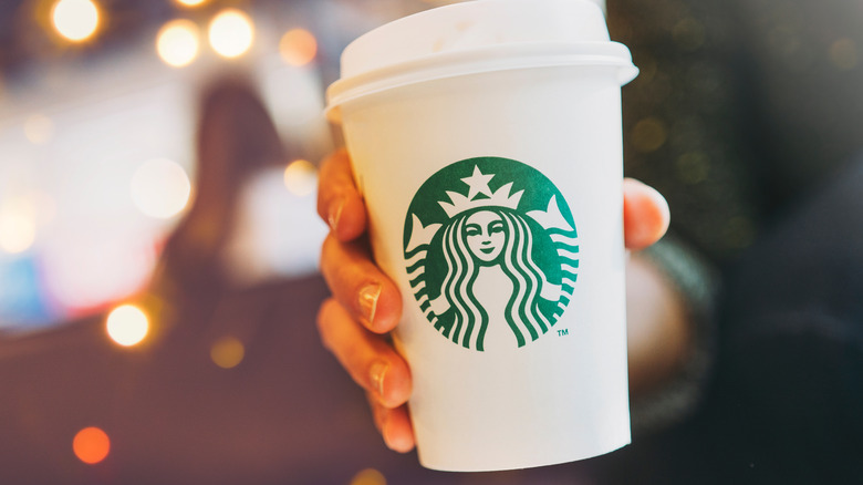 Starbucks drink in woman's hand