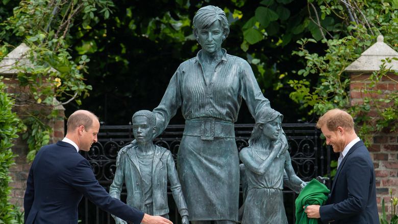 Prince William and Prince Harry by their mother's statue