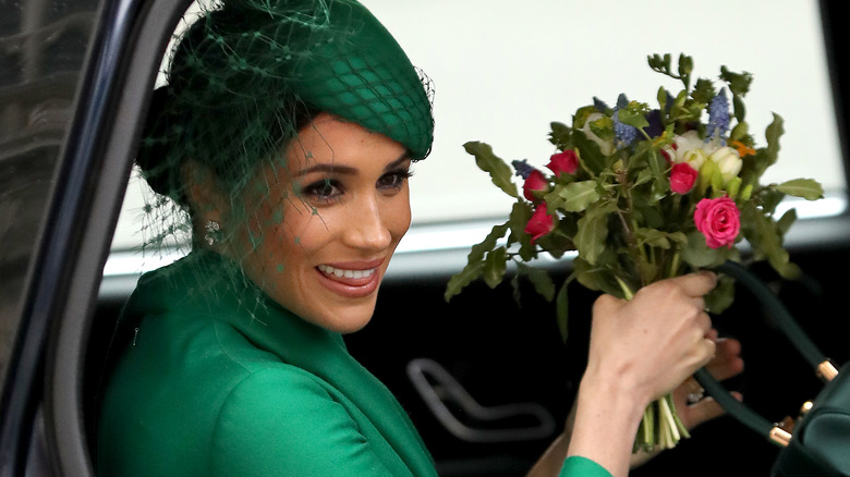 Meghan Markle holding flowers